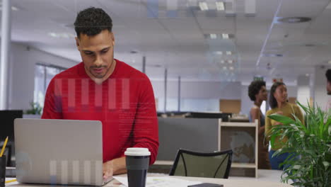 Animation-of-financial-data-processing-over-biracial-businessman-using-laptop-in-office