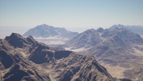 aerial view of a vast mountain range in a desert