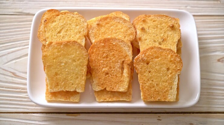baked crispy bread with butter and sugar