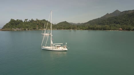 Aerial-view-of-sailing-Yachts-ocean-with-Islands-and-turquoise-ocean