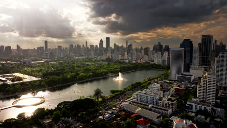 panorama of benjakitti park during sunrise in the khlong toei district of bangkok, thailand. aerial shot