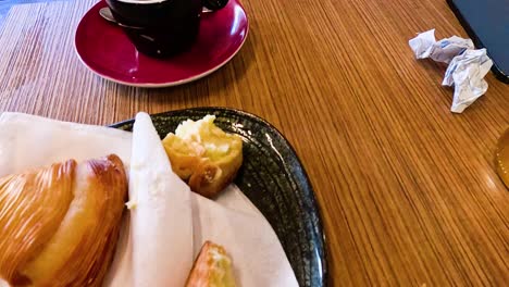 espresso and pastries on a wooden table