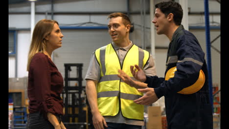 warehouse worker talking with management