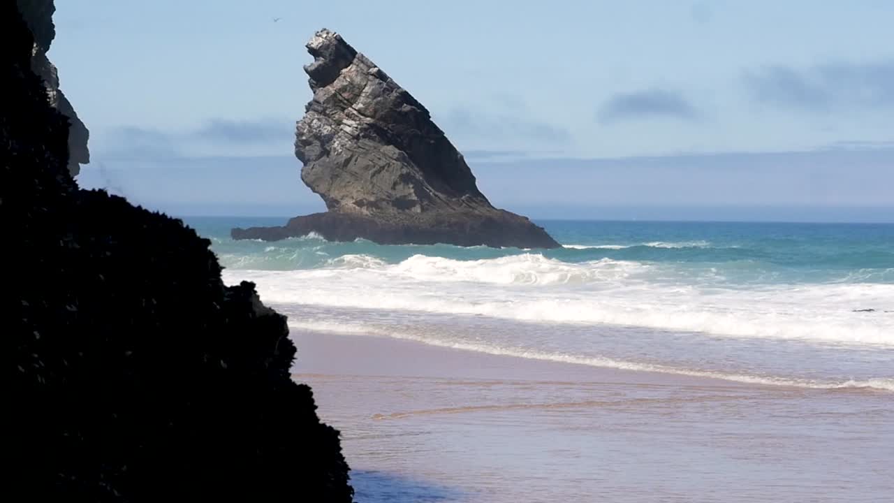 Slow motion still shot of Praia Da Adraga Beach ocean waves and cliff rocks in Sintra Almoc ageme Portugal Europe 1920x1080 HD