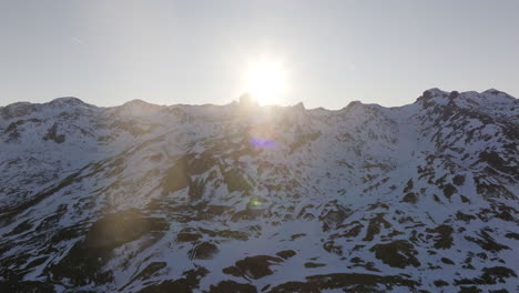 snowy mountain peaks at sunrise/sunset