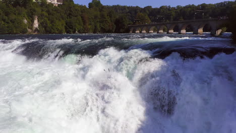 slow motion: panning shot of the roaring waterfall rheinfall at schaffhausen in switzerland