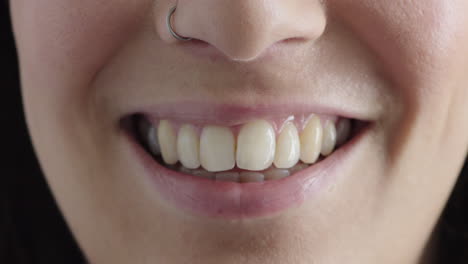 close up of young caucasian woman mouth smiling happy showing teeth soft healthy lips perfect skin