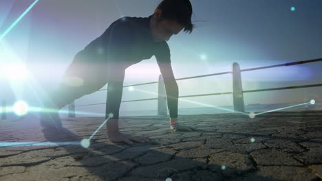 animation of network connecting dots, bright light, caucasian woman doing pushups on pier at beach