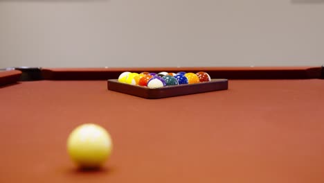 red felt billiards table or pool table with cue ball