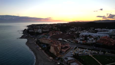 fuengirola sunset aerial flyover city push in movement