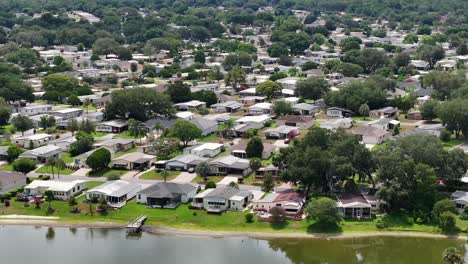 aerial wide shot of luxury villas with private beach and lake in the villages city, florida