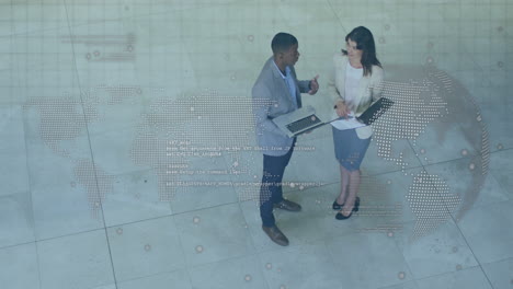 Animation-of-globe-and-map-over-high-angle-view-of-diverse-coworkers-discussing-reports-on-laptop