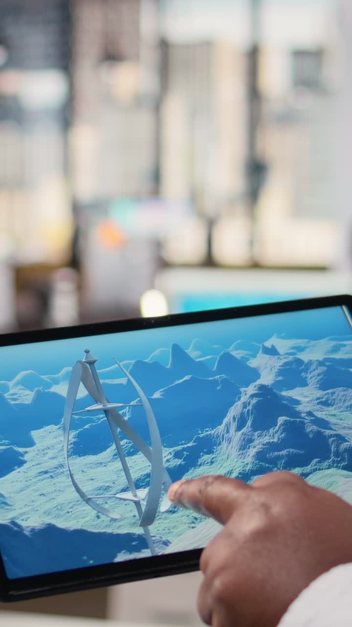 Close up of technician using tablet to work on futuristic wind turbine