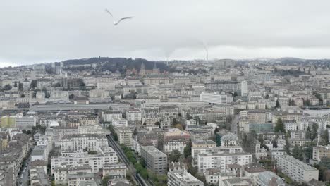 Drone-Aerial-of-the-beautiful-swiss-city-center-of-lausanne-located-on-the-lake-geneva-in-Switzerland-during-winter,-Europe