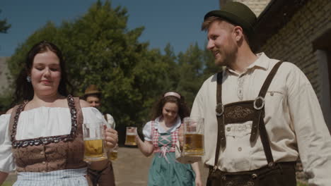 oktoberfest celebration with people in traditional costumes drinking beer