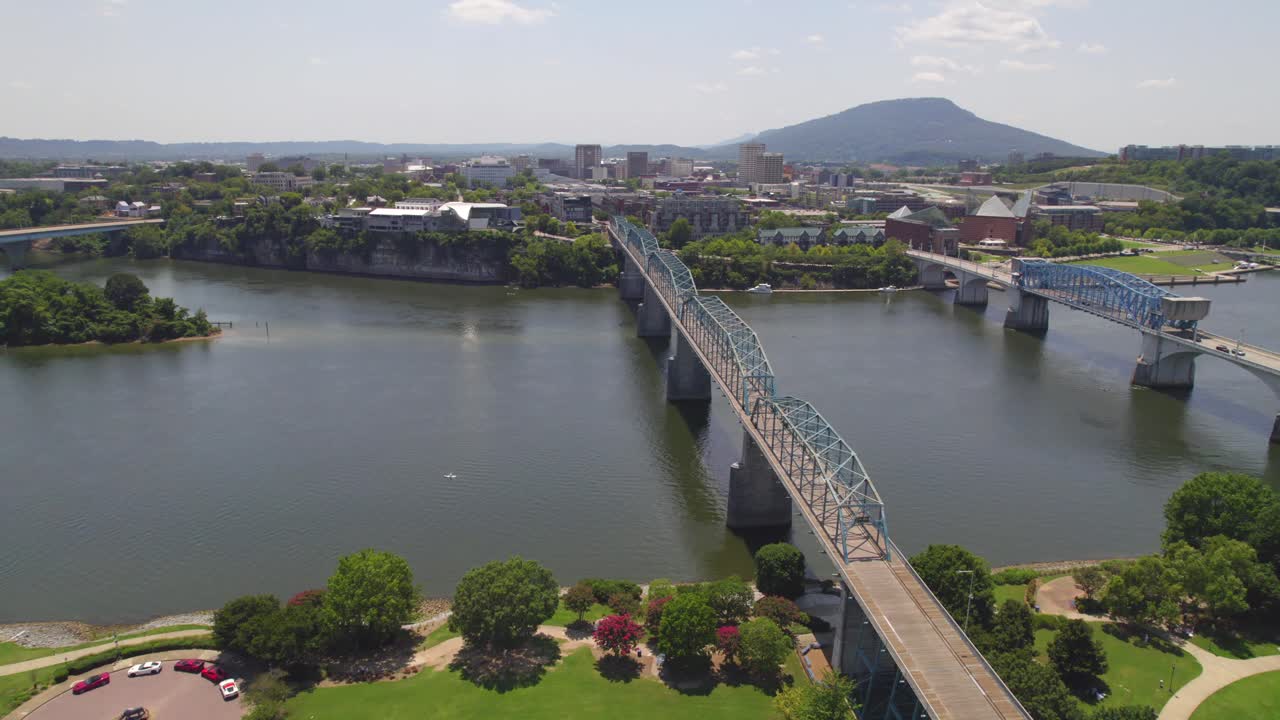 Drone Aerial Slow rise to reveal Chattanooga Tennessee with Blue bridge and river on a summer day