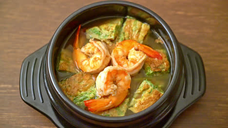 sour soup made of tamarind paste with shrimps and vegetable omelet - asian food style