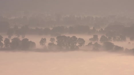 a mesmerizing timelapse of a foggy morning near lake como, captured with a telephoto lens. the serene landscape unfolds in soft light and distant mist.