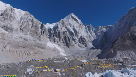 Aerial view of Khumbu Glacier at Everest Base Camp with tents, melting ice, global warming, and stunning Nepal Himalaya adventure scenery landscape seen by tourist climbers, clear sky view
