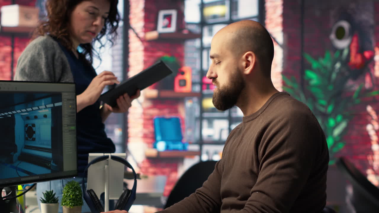 Coworkers using AI chatbot interface to generate video game spaceship