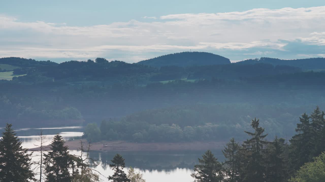 Serene Mountain Lake Landscape with Misty Forests