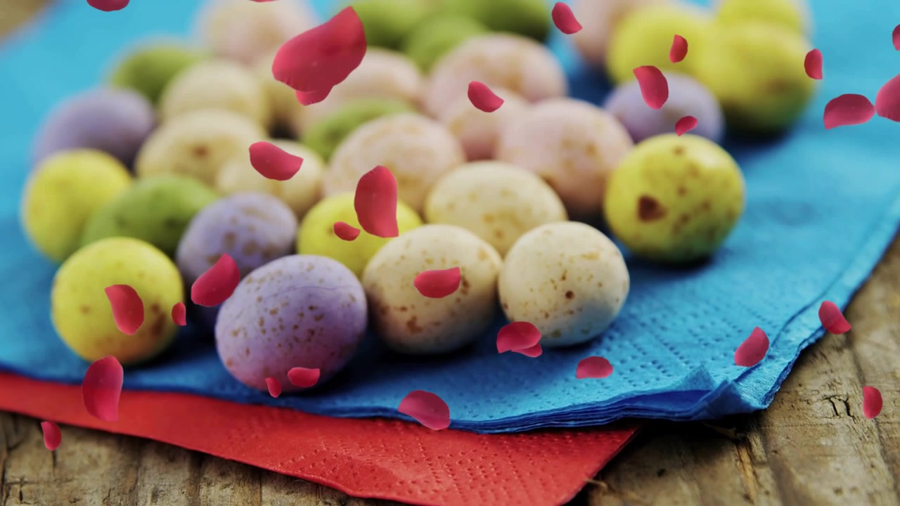 Camera pulling back, red petals drifting, revealing pastel eggs on layered napkins for marketing