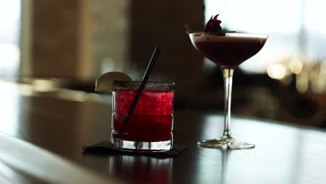 fancy alcohol cocktails in margarita glass on display at a bar