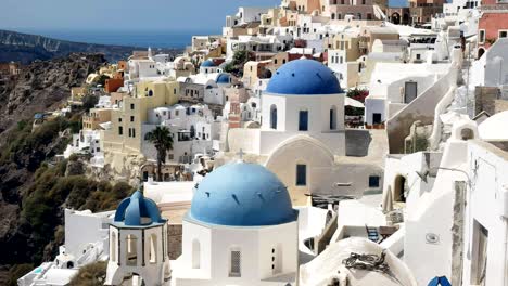 close up of the three blue domes at oia, santorini