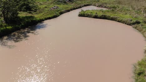 lake in the plain of colombia, with fishermen