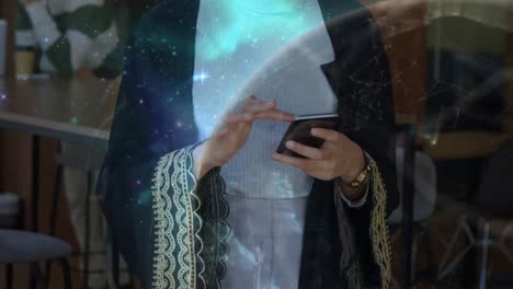 animation of globe and networks of connections over mixed race businesswoman using smartphone