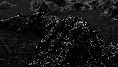 monochrome animation of waves and ripples noise on black surface like asphalt.