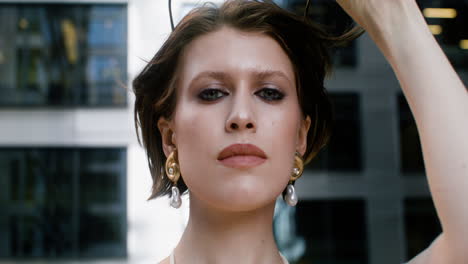 close-up view of elegant woman putting the sunglases on