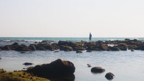 One person fishing on the coast of Saint Martin's Island, Bangladesh, wide shot