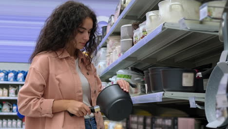 woman shopping for kitchenware in a supermarket