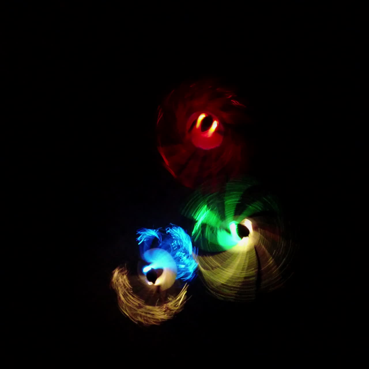 Dancing girls in LED costume at night outdoor. LED show. Square video