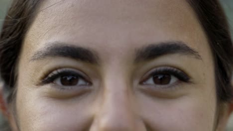 closeup shot of beautiful woman taking off eyeglasses