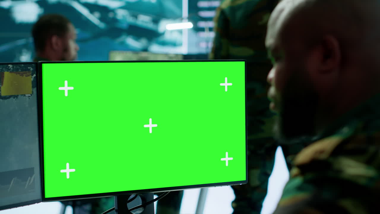 Army officer gathers intelligence from radar next to isolated copy space