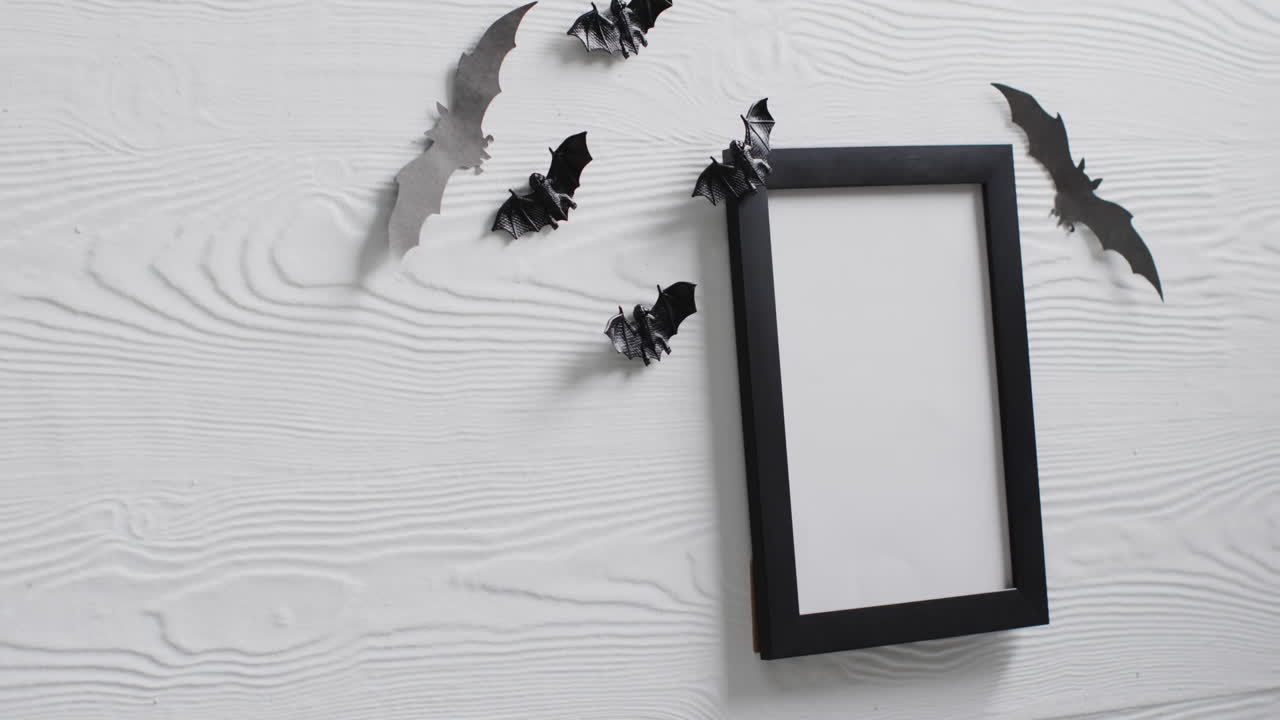 Video of black frame and bats with copy space on white background