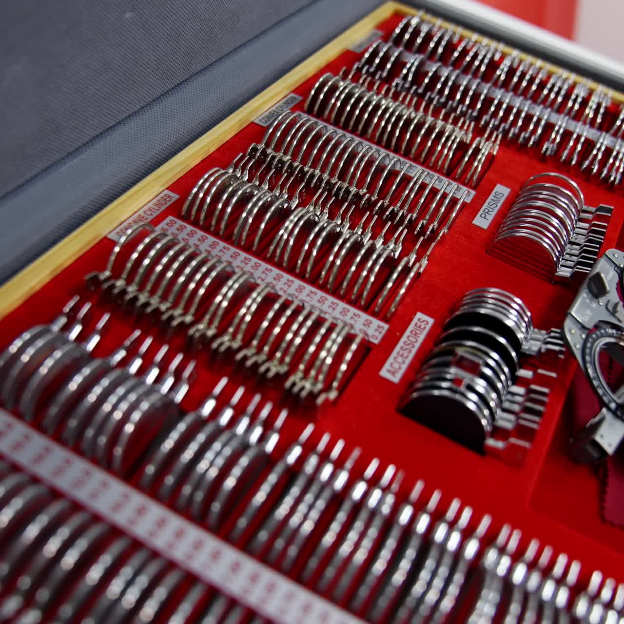 Medical accessories for optician. Case full of lenses for eye examination. Trial frame and lenses in a box for ophthalmologist