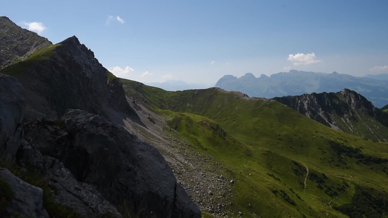 View from a mountain top in the alps of Liechtenstein. Pan left offering a panoramic view over the Valley of malbun