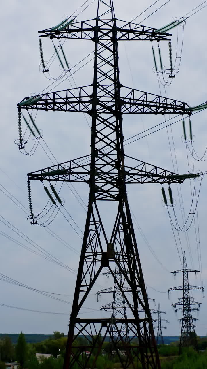 Electricity transmission power lines. Power line of the electric wires. Vertical video