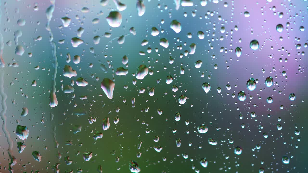 Background with raindrops. Wet window during rain with water droplets. Raindrops on glass. Close-up.
