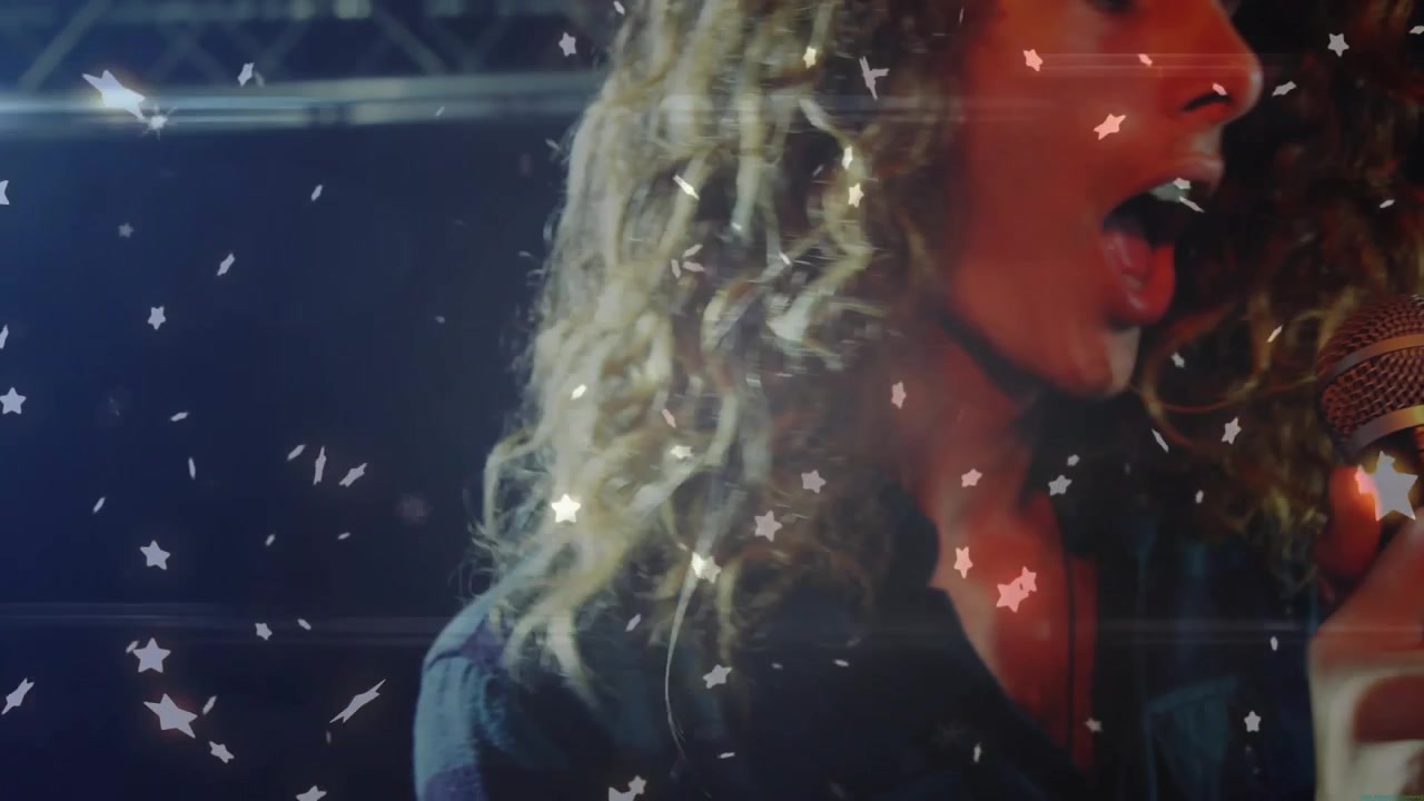 Spotlight hitting lead singer, gripping mic, belting, camera shifting, star overlay, leading band