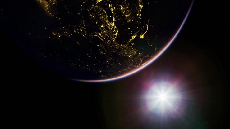 View of earth from space with sunlight illuminating the atmosphere