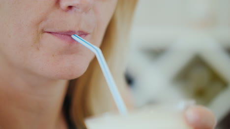 Woman-Drinks-A-Cold-Drink-From-Ice-And-Wine-From-A-Straw