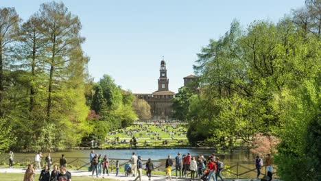 parch sempion with lush green trees and river in milan