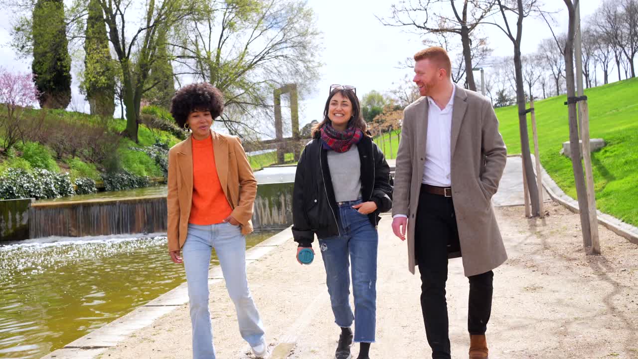People walking and talking in a park