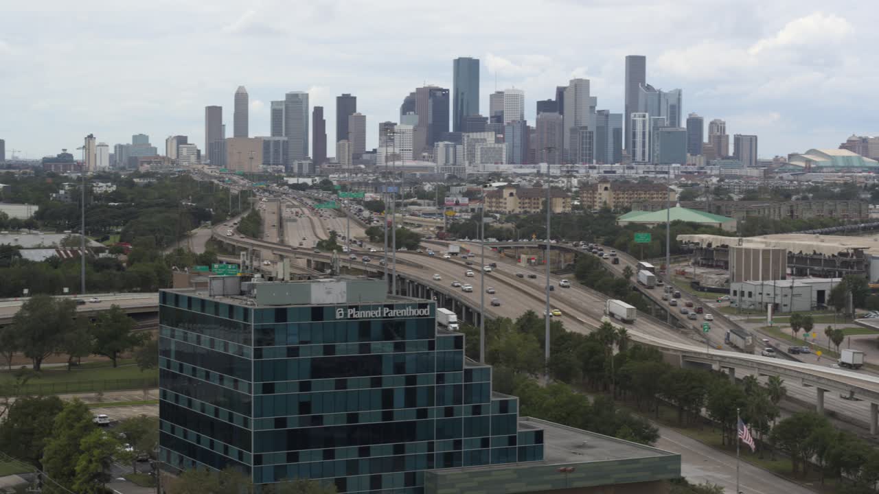 Drone view of Planned Parent Hood building and downtown Houston, Texas