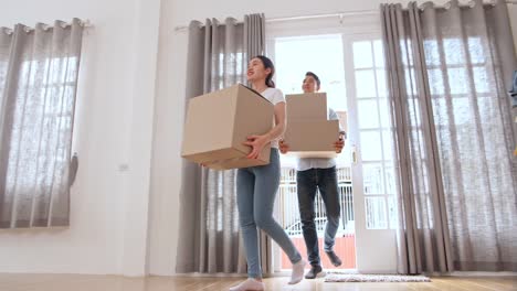 asian couple moving to new house