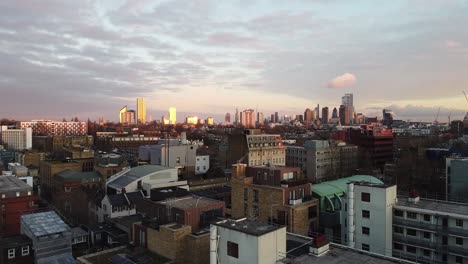 rising up above city of london during amazing sunset. aerial panoramic view.